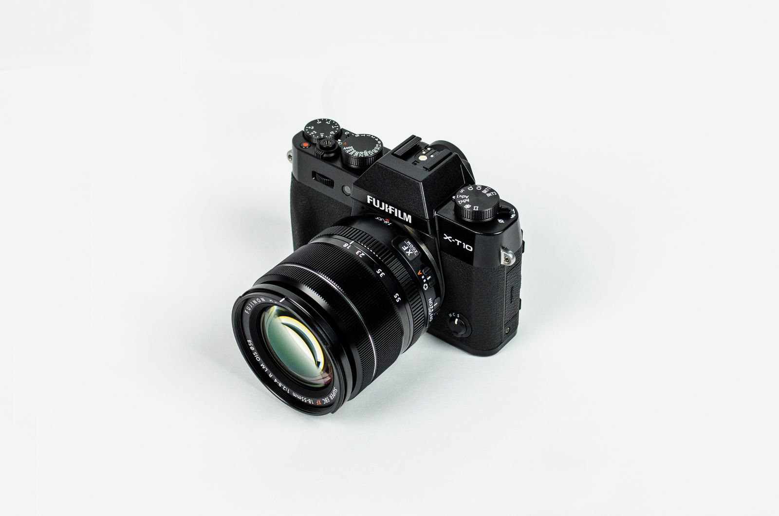 Black Fujifilm camera with a zoom lens